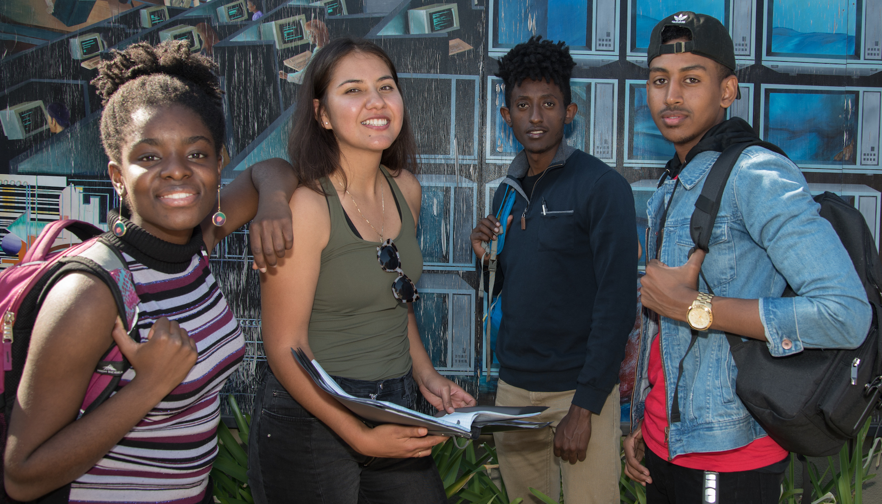 students in a group smiling