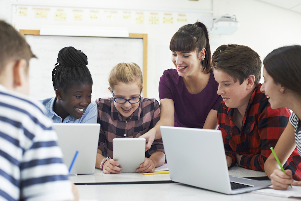 group of students around table