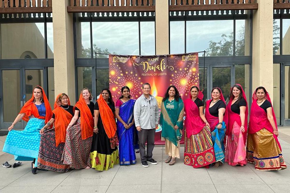 group in colorful saris standing in front of Flint Center