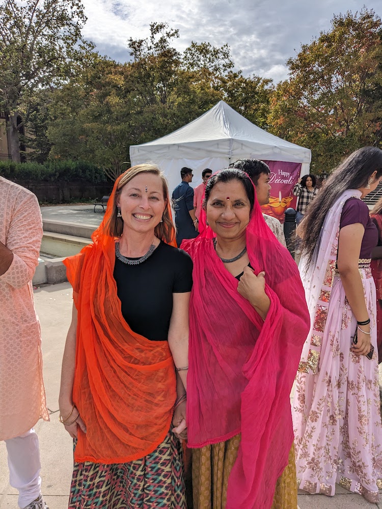 two women in colorful gowns