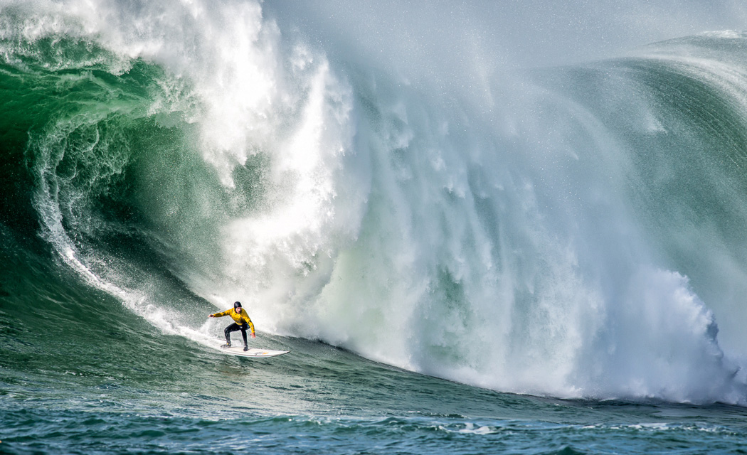 2015 Waterways Exhibit Image, surfer in front of huge wave