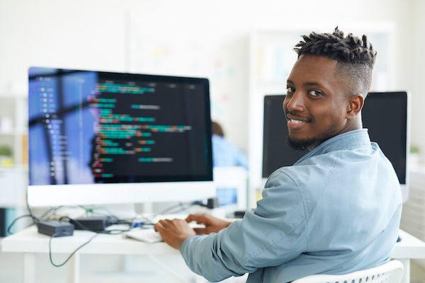 young man at computer screen