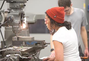 woman using machining tools