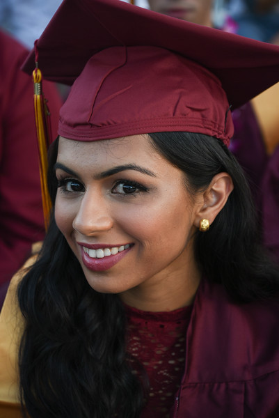 smiling young woman in grad cap