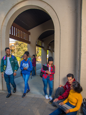 students under arches