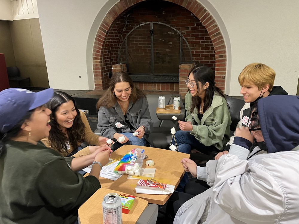 students laughing around table