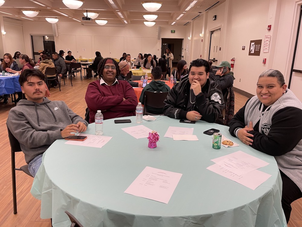 family members sitting around table