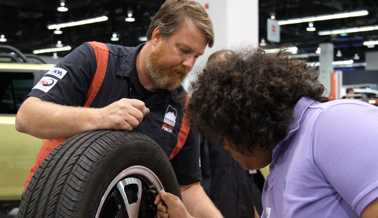 men with automotive tire